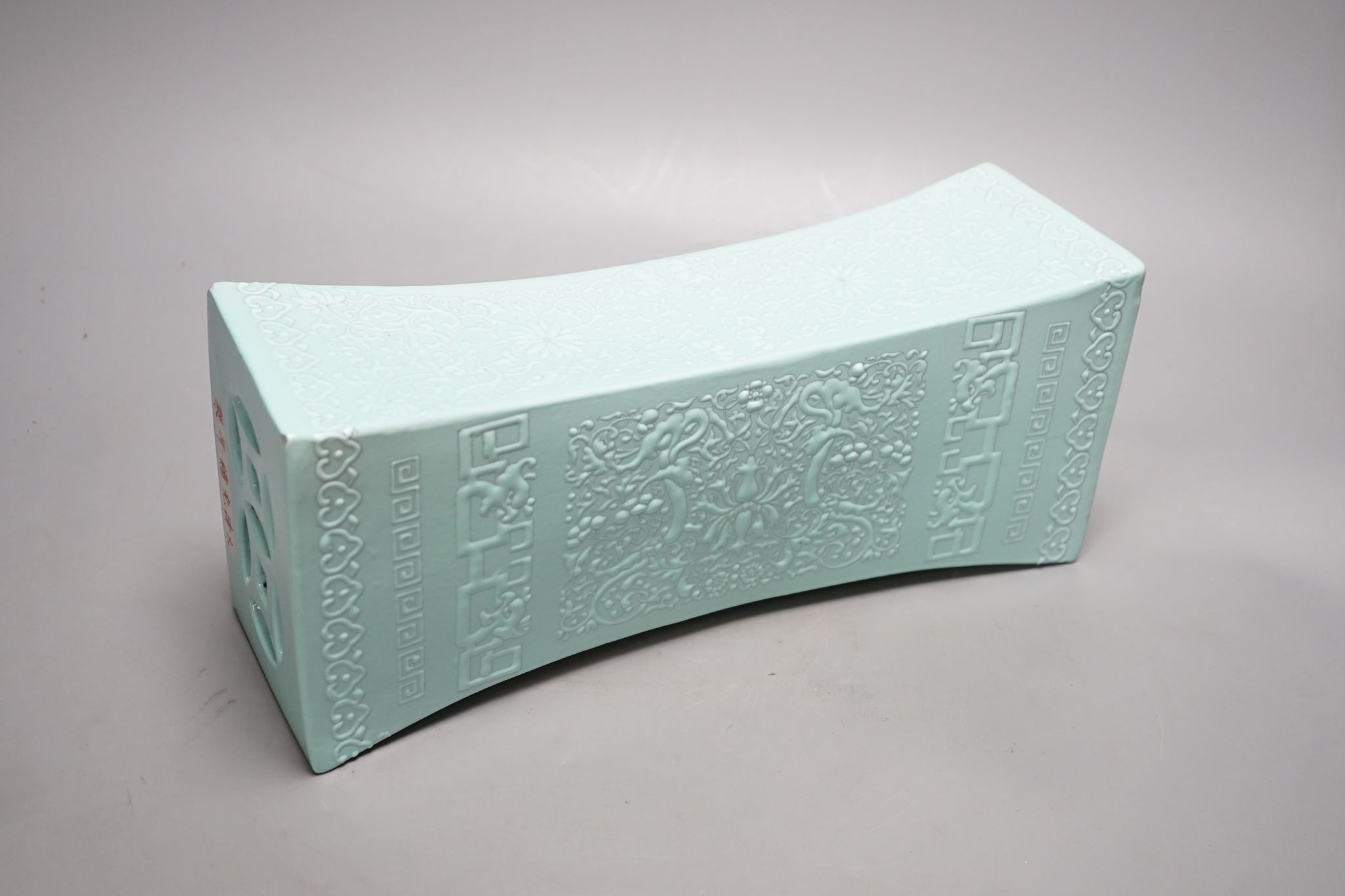 A Chinese turquoise glazed pillow, 33 cms wide.